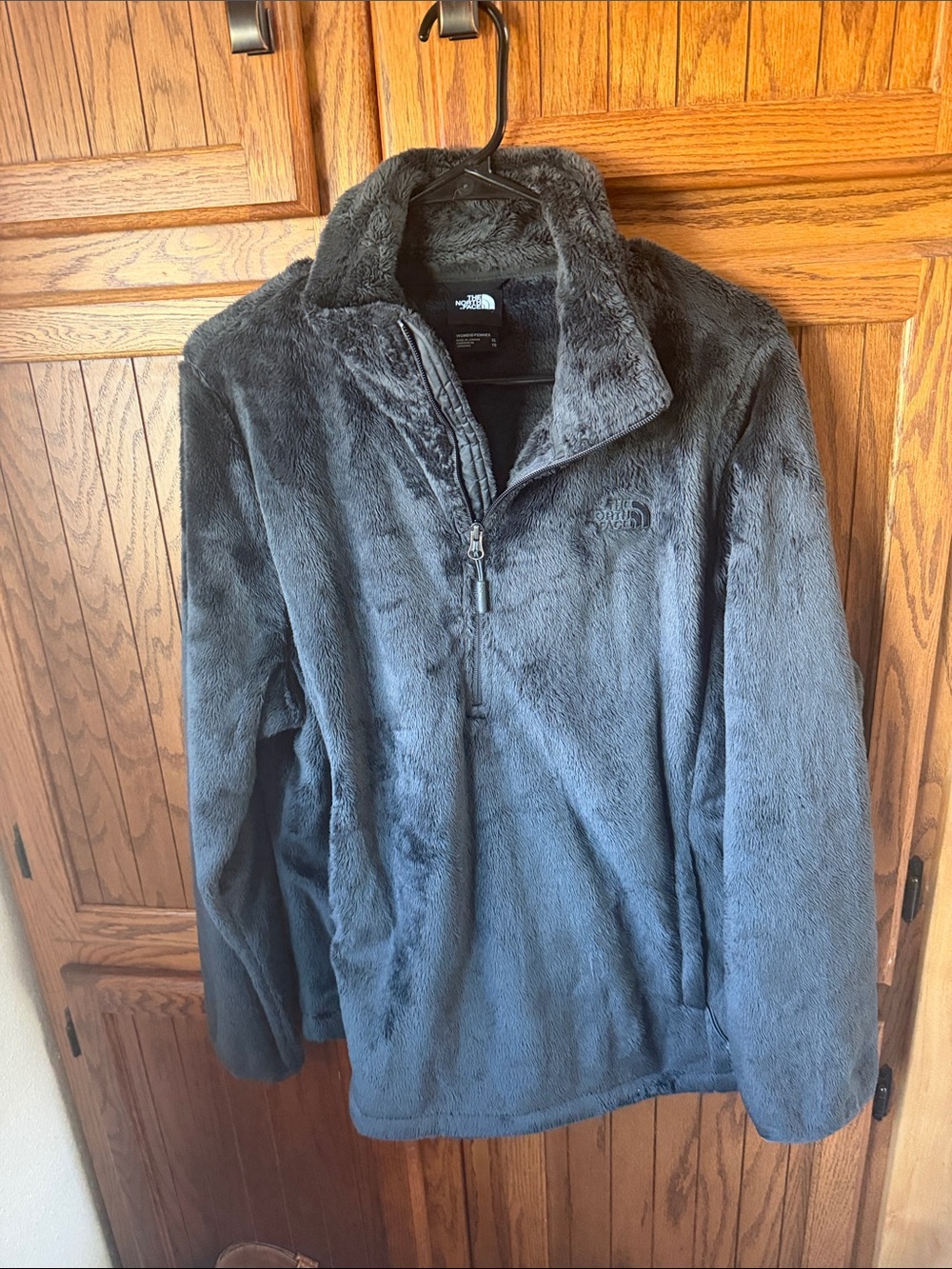 The North Face woman’s black Plush Quarter-Zip Fleece